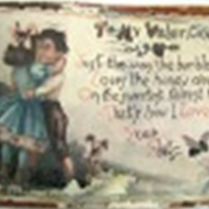 A Valentine’s Day postcard from the 1910s. There is an illustration of a young girl embracing a young man. A poem, “To My Valentine,” appears on the front. There is a good deal of damage to the postcard as it was recovered from the wrecksite, and not everything is legible.